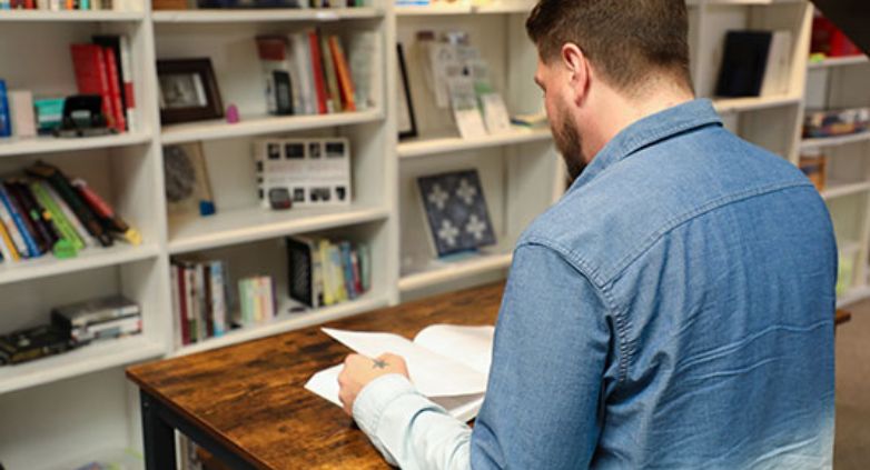 A man reading a book about Alcohol  Use Disorder