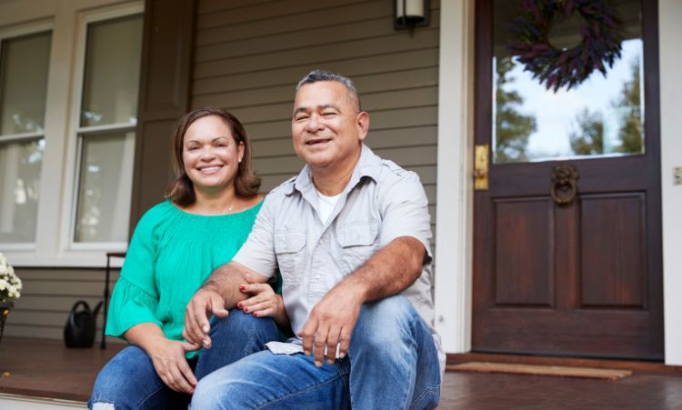 A man and woman enjoy time on their porch, highlighting the importance of family in opioid addiction treatment in Chester, CT.