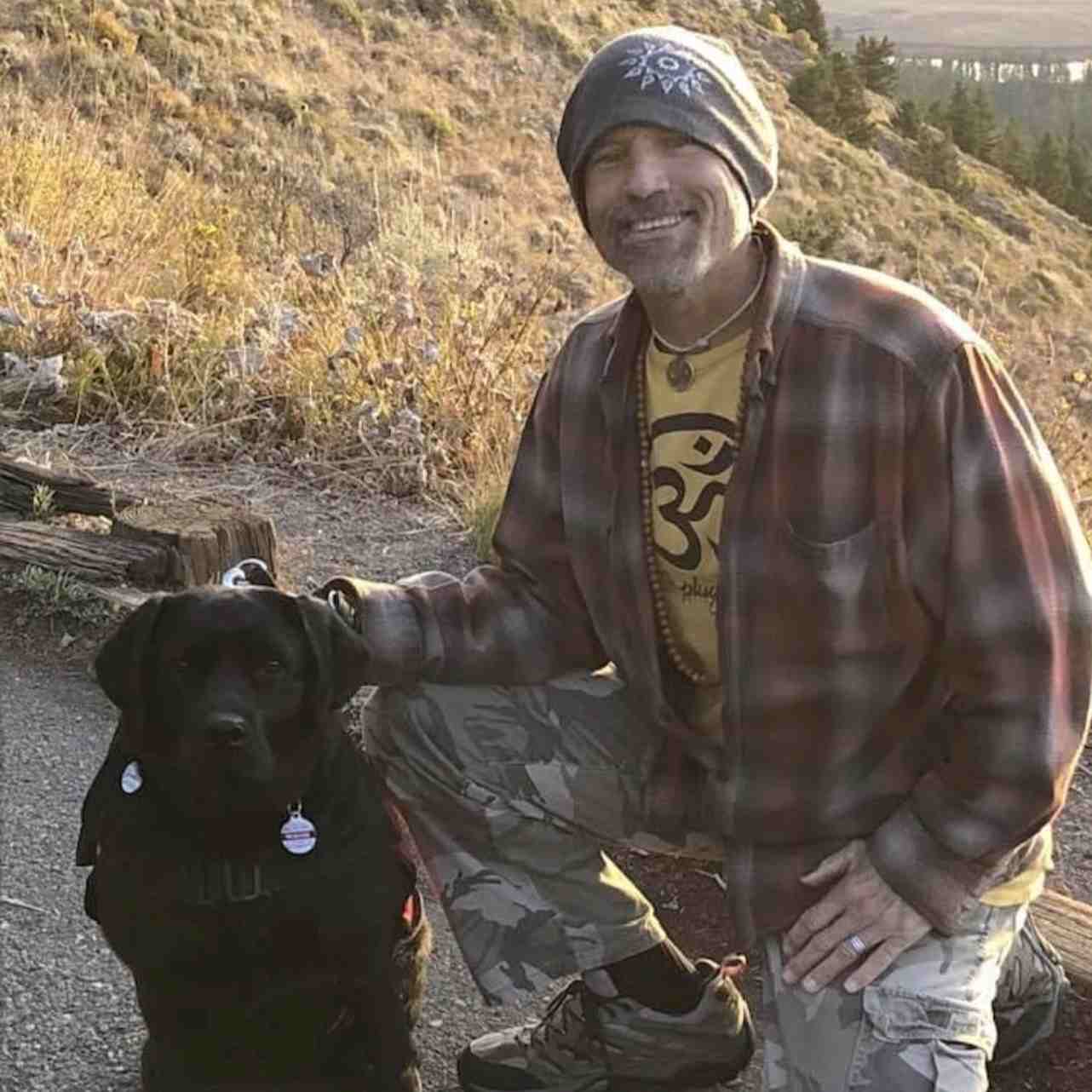 Mark Knobloch recovery coach outdoors with dog, representing Project Courage team