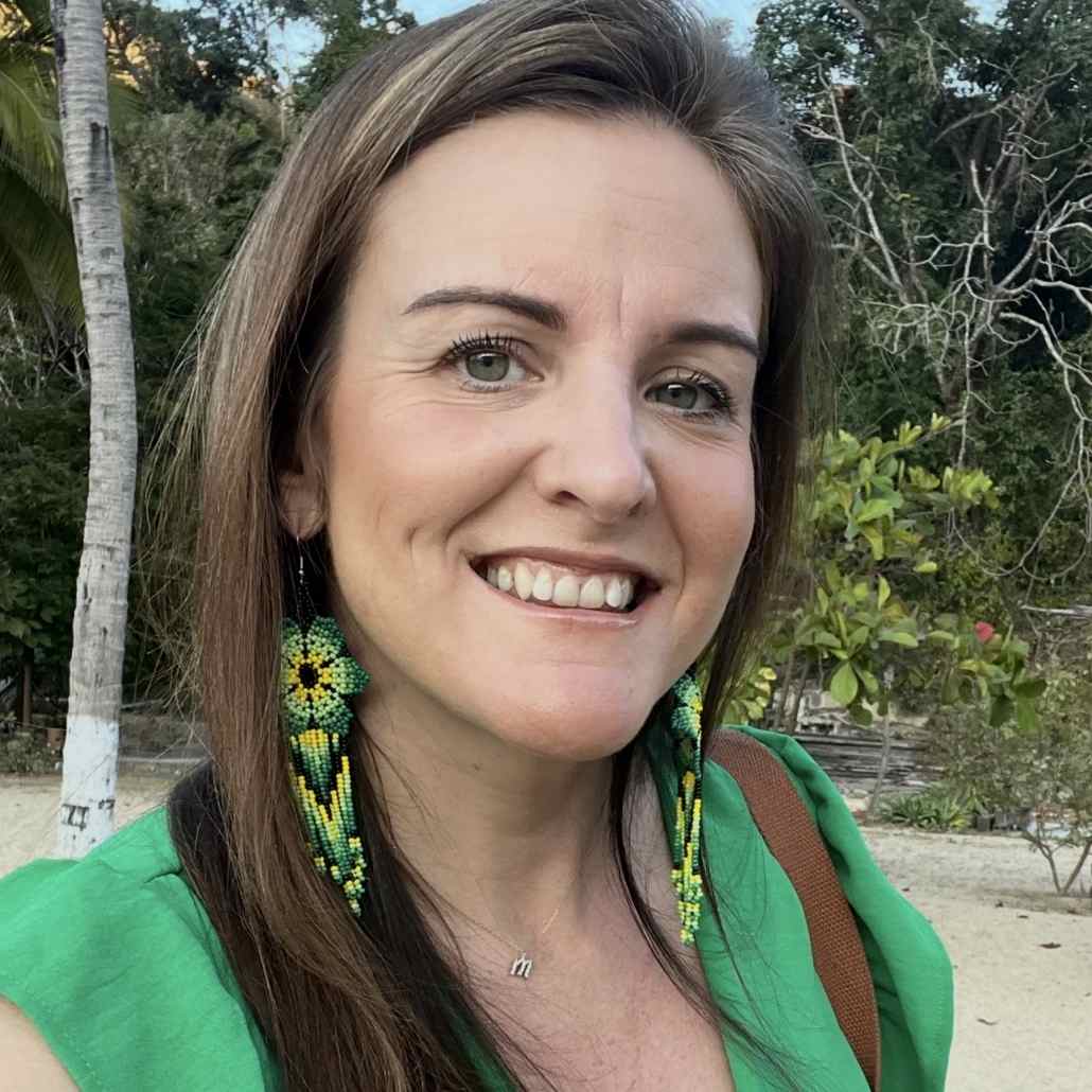 Professional headshot of Mary Kwasniewski smiling outdoors, representing Project Courage team member