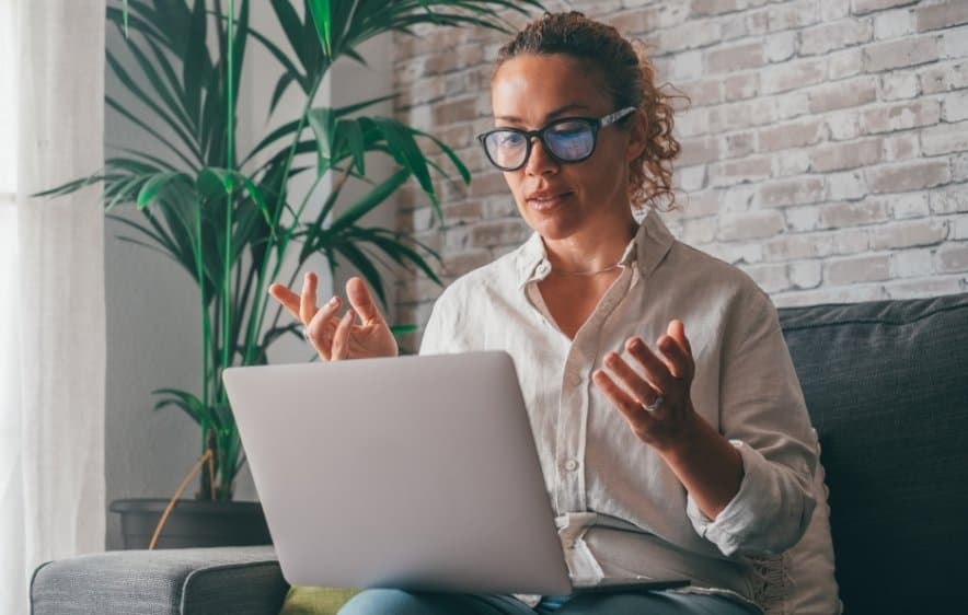 Woman attending virtual IOP therapy session online in Connecticut