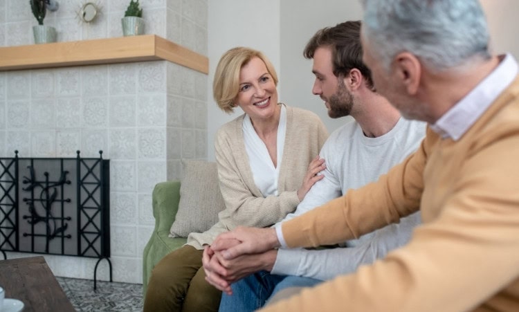 Family encouraging a loved one during alcohol recovery with compassion and understanding