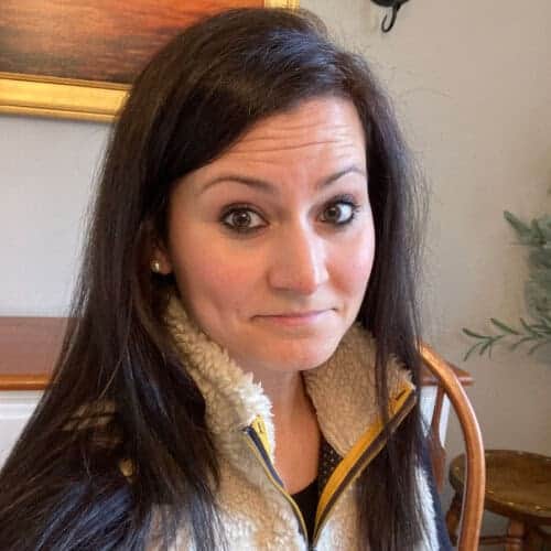 Courtney Bushnell, Project Courage team member, smiling in a welcoming indoor setting