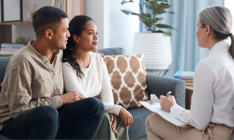 Couple meeting with a counselor for family addiction support in Connecticut
