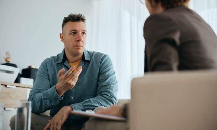 Man in intensive outpatient therapy session for addiction treatment in Connecticut
