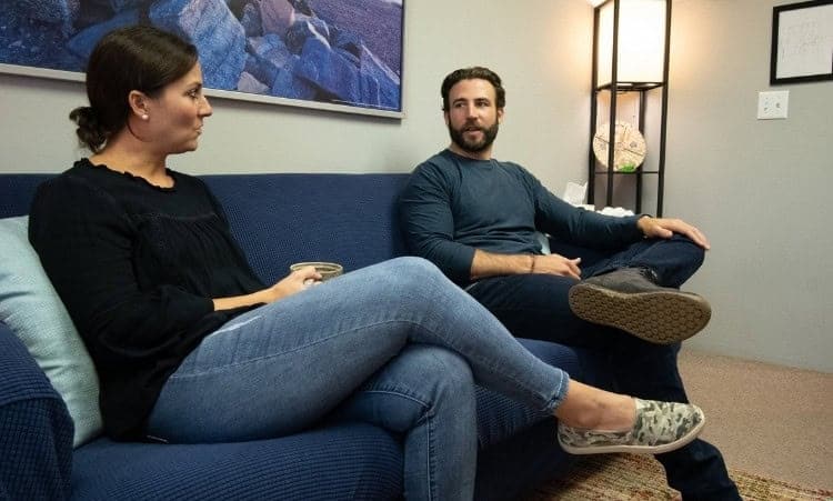 Two adults discussing intensive outpatient alcohol recovery in Essex, CT.