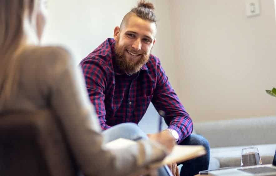 Man speaking with a counselor about drug addiction recovery in Essex, CT.