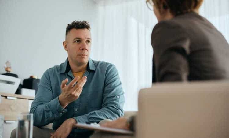 Client in intensive outpatient therapy with counselor for recovery in Waterford, CT.